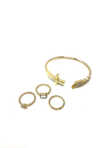 Gold Tone Cuff Bracelet and Set of Three Rings