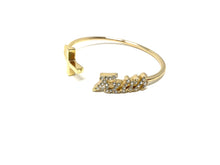 Load image into Gallery viewer, Gold Tone Cuff Bracelet and Set of Three Rings
